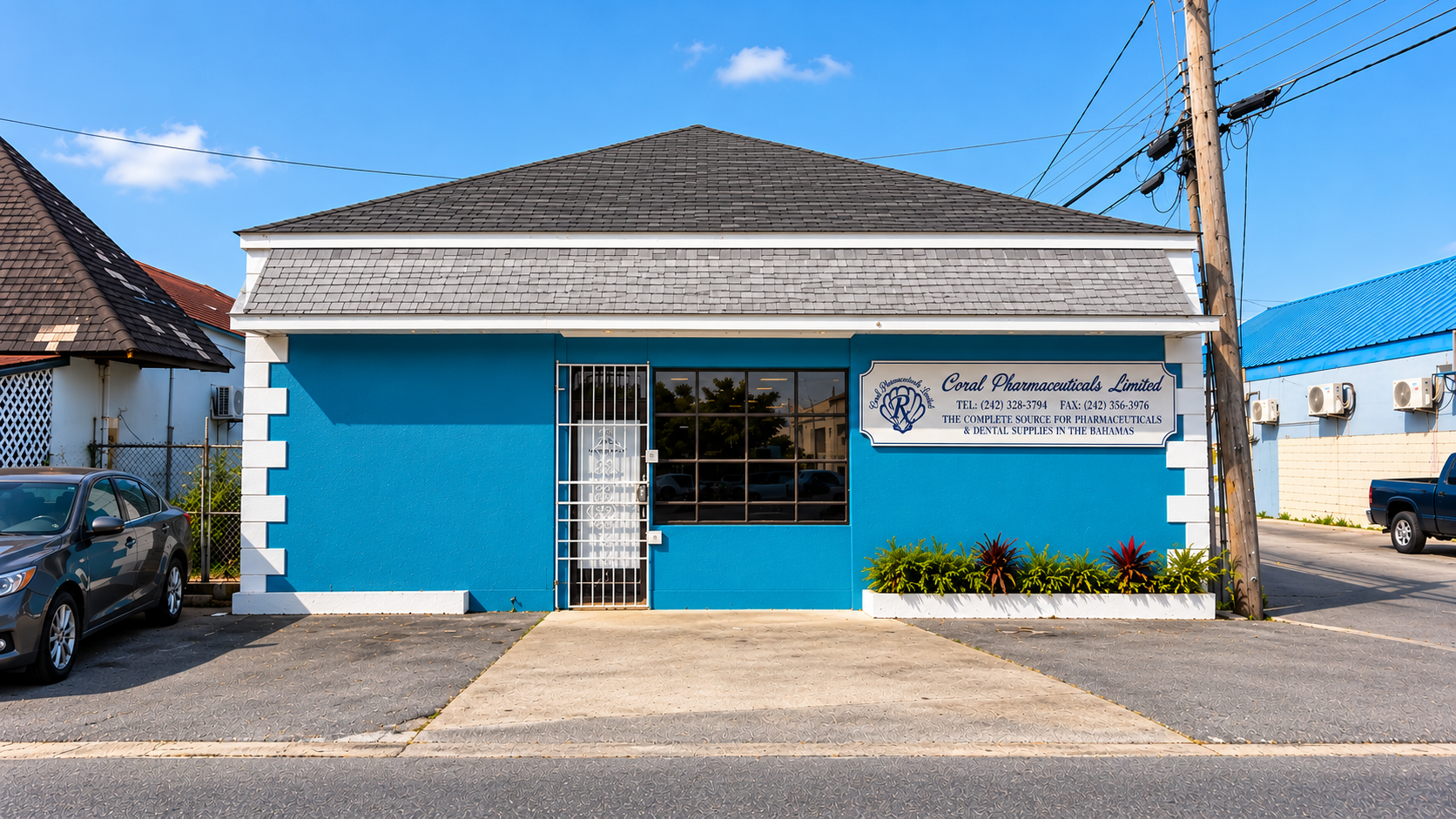 Exterior of Coral Pharmaceuticals’ blue Nassau office and warehouse